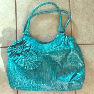 Light blue purse with flowers.